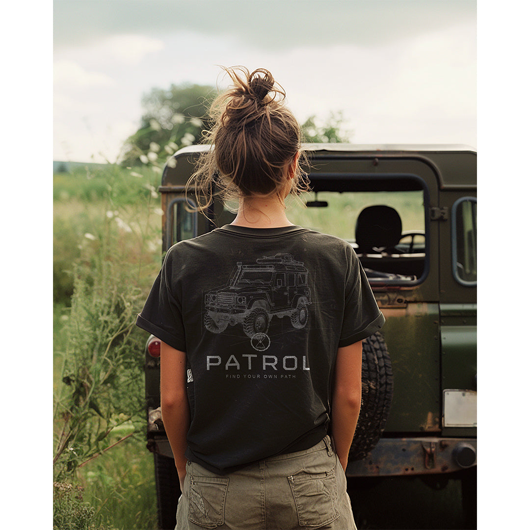 A woman wearing the Patrol Offroad Blueprint Tee, off roading, 4x4, outdoors,100% cotton unisex tee